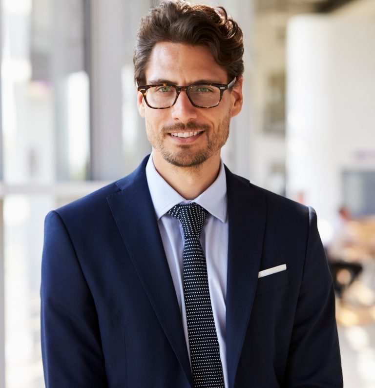Portrait of young professional man in suit